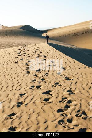 Walking in Maspalomas Dunes in Gran Canaria, Spain Stock Photo