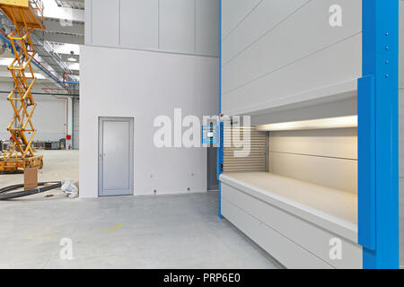 High density carousel storage in distribution warehouse Stock Photo