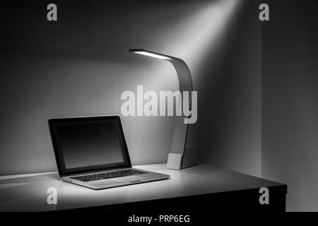Modern Sleek Design Desk Light & Laptop Computer Stock Photo