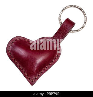 empty handmade burgundy colored leather heart shaped key fob cut out on white background Stock Photo