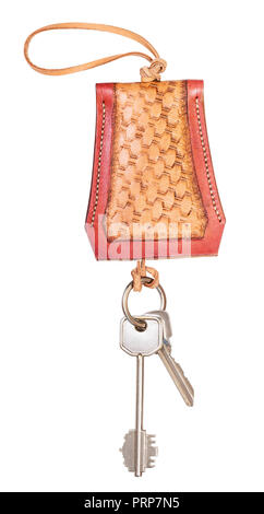 door keys on handmade embossed leather Key Holder cut out on white background Stock Photo