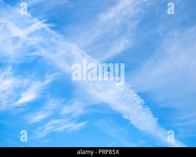 white spindrift clouds in blue sky in sunny autumn day Stock Photo