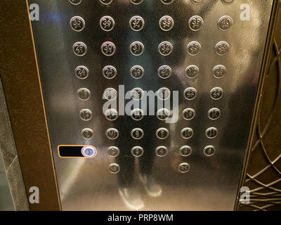 panel with many buttons in modern passenger elevator of high-rise building Stock Photo