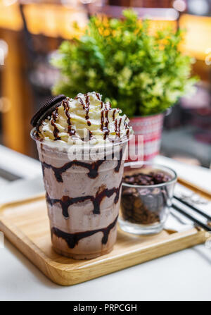 chocolate frappe with whipped cream on table Stock Photo