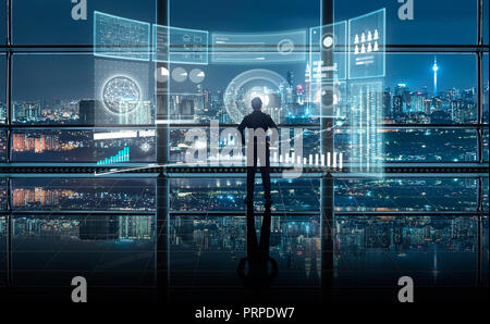 Smart financial analytics working at modern office with big data ,connections icon, internet of things, financial charts and graph virtual screen. Stock Photo