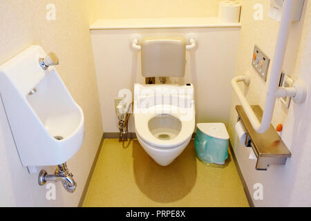 Toilet and handrail for disabled people at the toilet room in hospital, safty and medical concept Stock Photo