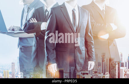 Business partner team standing together , double exposure effect with cityscape  . Stock Photo