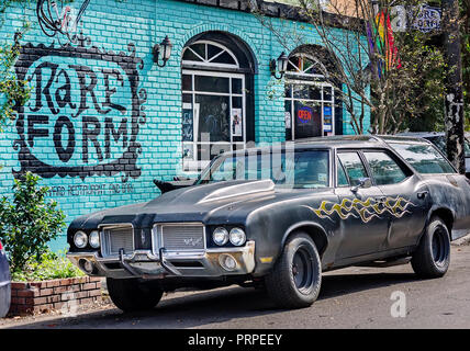 A wall mural and custom-painted Vista Cruiser greets patrons of Rare Form restaurant and bar, November 11, 2015, in New Orleans, Louisiana. Stock Photo