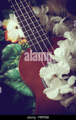 closeup photo of a ukulele against an exotic background Stock Photo