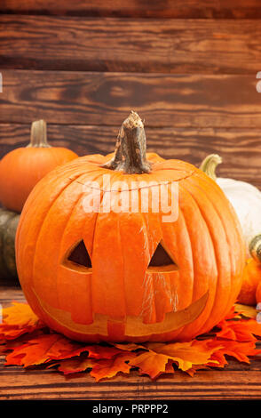 A Carved Jack O Lantern on a Wooden Table Stock Photo