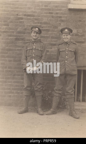 * Vintage Photograph of Two Laughing WW1 British Army Soldiers. One of The Soldiers is Having a Cigarette. Stock Photo