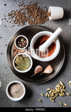 top view of various aromatic dried spices on grey surface Stock Photo