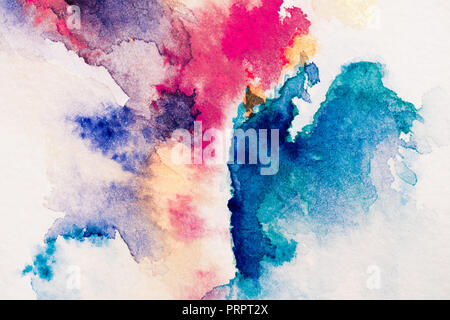 abstract painting with red, purple and blue watercolor paints on white background Stock Photo
