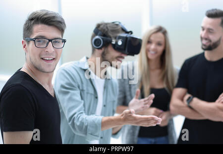 Positive colleagues testing virtual reality glasses Stock Photo