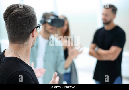 Positive colleagues testing virtual reality glasses Stock Photo