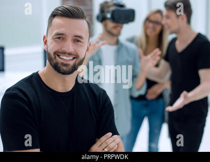 Cheerful colleagues testing virtual reality glasses Stock Photo