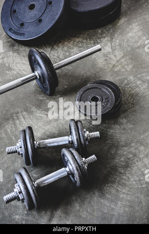 high angle view of various gym equipment on concrete surface Stock Photo