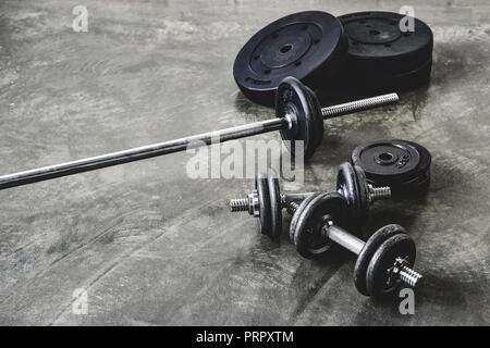 high angle view of various gym equipment on concrete floor Stock Photo