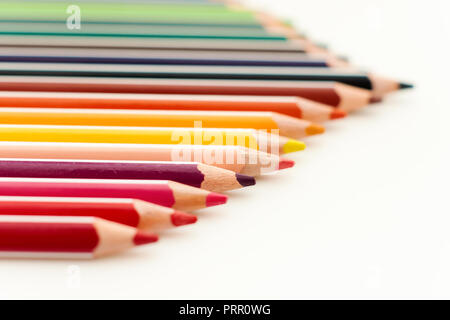 Colored sharpened pencils close up isolated on white background. School drawing set. Multicolor pencils collection. Selective focus Stock Photo