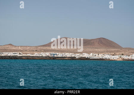 Lanzarote, Canary Islands: Atlantic Ocean and panoramic view of the skyline of La Graciosa, the main archipelago island Chinijo Stock Photo