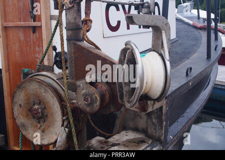 Pulleys and ropes on board a small fishing boat Stock Photo