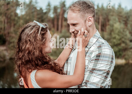 handsome man touching face of girlfriend with closed eyes Stock Photo -  Alamy