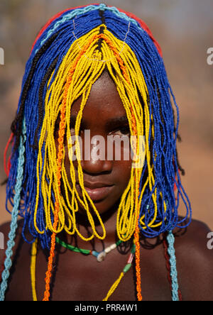 Portrait of a Mudimba tribe girl with a beaded wig during the fico ceremony, Cunene Province, Cahama, Angola Stock Photo