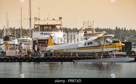 SEATTLE WA, USA - JUNE 2018: De Havilland Beaver float plane operated by Kenmore Air at the seaplane terminal in downtown Seattle at dawn. Stock Photo