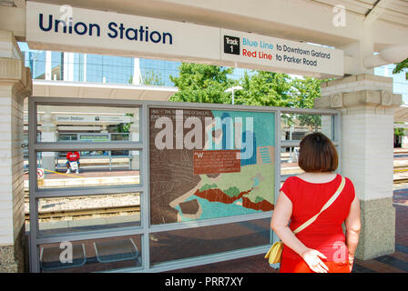 Person looking at a map and travel information at Union Station in downtown Dallas Stock Photo