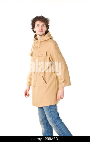 Nice man wearing in raincoat making a step Stock Photo