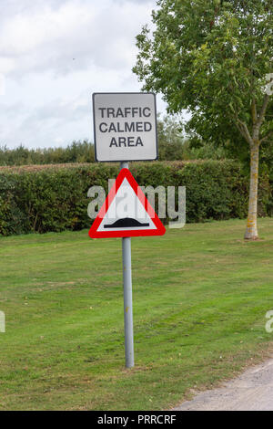 Road sign for traffic calmed area warning of speed humps Stock Photo