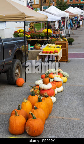 JONESBOROUGH, TN, USA-9/29/18: Pumpkins displayed in parking lot at Farmers' Market. Stock Photo