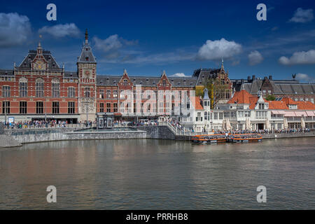 Centraal Station, main station, in the foreground a boat dock for canal cruises, Amsterdam, The Netherlands Stock Photo