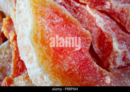 Dried papaya fruit in slices closeup macro shot Stock Photo