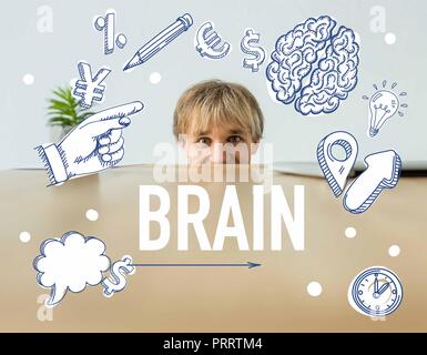 Man looking out from table and looking at camera with brain inscription and business signs Stock Photo