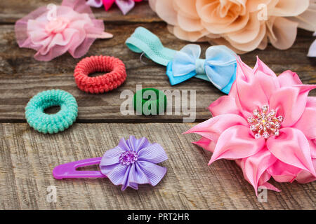 Different hair clips on wooden background Stock Photo