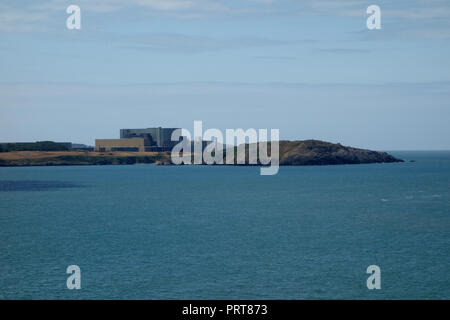The Magnox Wylfa Head Nuclear Power Station on the Isle of Anglesey Coastal Path from Across Cemaes Bay, Wales, UK. Stock Photo
