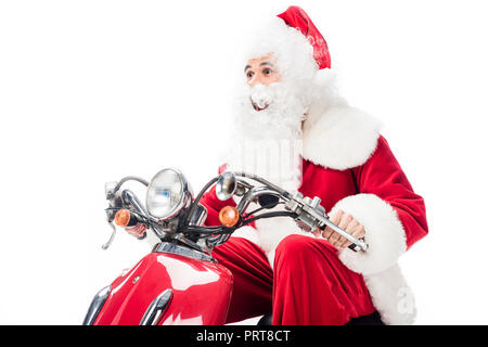 cheerful santa claus in costume riding on scooter isolated on white background Stock Photo