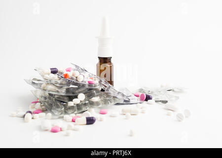 Different medical pills and spray on white background with copy space Stock Photo