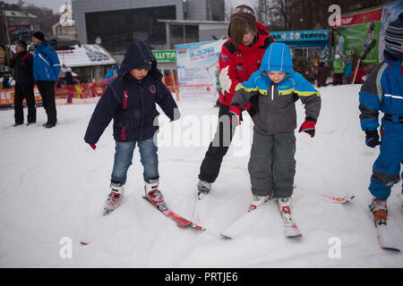Ukraine, Kiev ski resort Protasov Yar January 25, 2015. The ski slope in the city center. Ski school for children. The instructor teaches a group of p Stock Photo