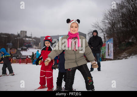 Ukraine, Kiev ski resort Protasov Yar January 25, 2015. The ski slope in the city center. Ski school for children. The instructor teaches a group of p Stock Photo