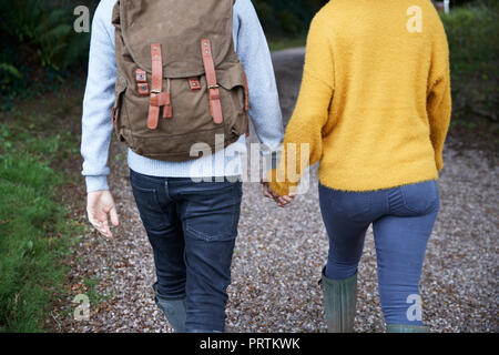 Hiker couple walking in countryside Stock Photo