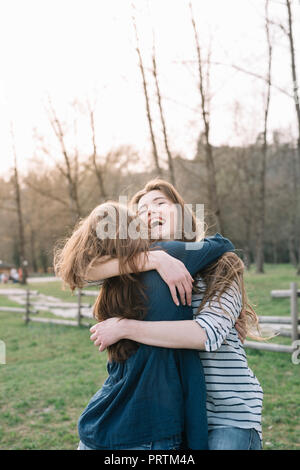 Happy girlfriends in park Stock Photo