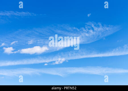light spindrift and cumulus clouds in blue sky in sunny september day Stock Photo