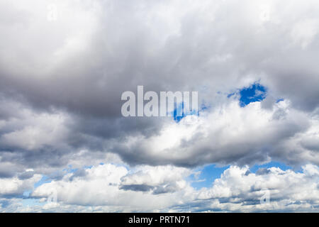 low large cumulus clouds in blue sky in september afternoon Stock Photo