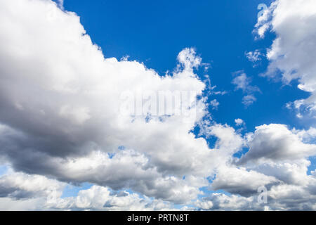 front of low cumulus clouds in dark blue sky in september afternoon Stock Photo