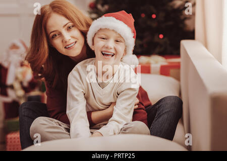 Portrait of happy family sitting together Stock Photo