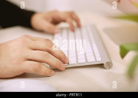 Typing hands on keyboard. Stock Photo