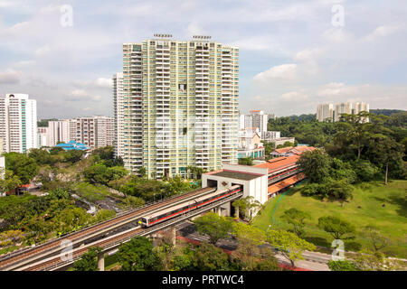 aerial view of Bukit Batok township, with train approaching the MRT station, a matured residential town located the West Region of Singapore. Stock Photo