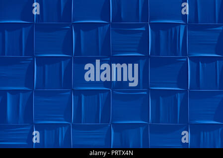 Background is blue. Decorative panel made of fabric Stock Photo